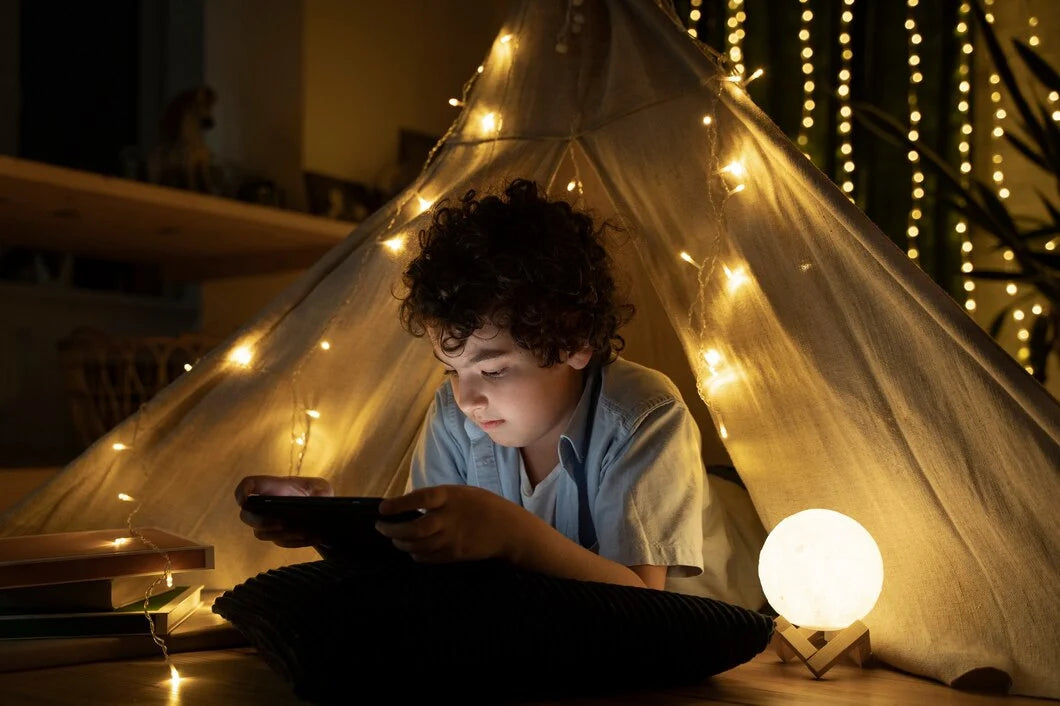 close-up-child-reading-his-house-tent