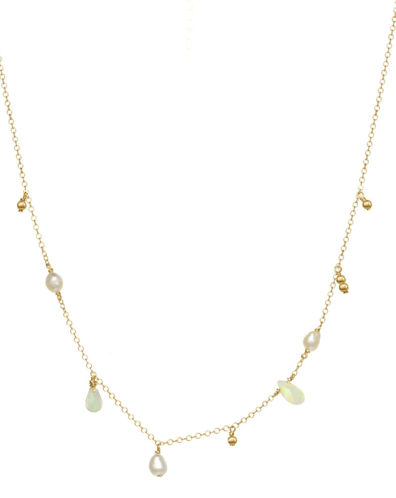 Genevieve Necklace by KOZAKH. A 16 to 18 inch adjustable length necklace in 14K Gold Filled, featuring 3-4mm white rice Pearls and 5-6mm faceted Ethiopian Opal droplets.