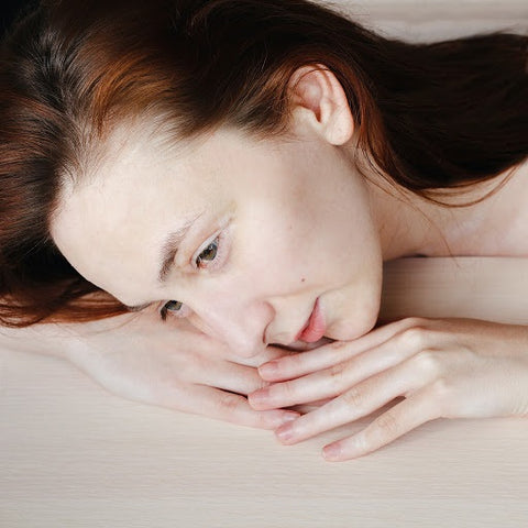 A woman lying down on a bed