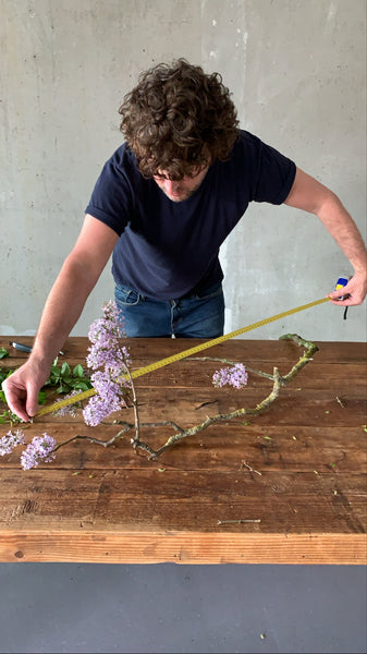 @the_ikebana_project measuring the flowers for the Ikebana creation for NUDE Glass