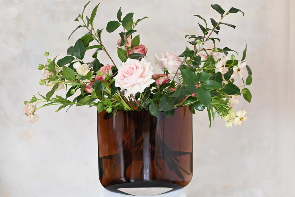 The loose bouquet put in a caramel colored NUDE Blade vase