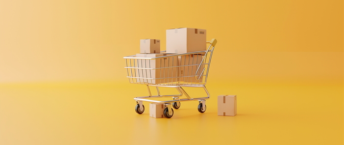 A shopping cart is filled with cardboard boxes to represent the concept of dropshipping.