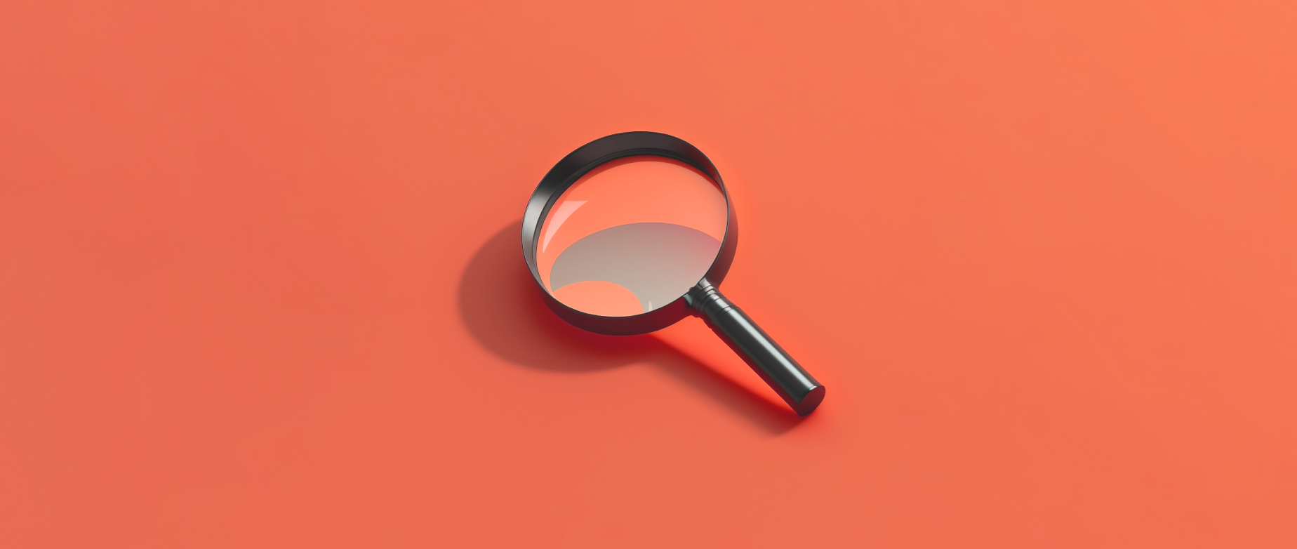 A silver magnifying glass on a red orange background.