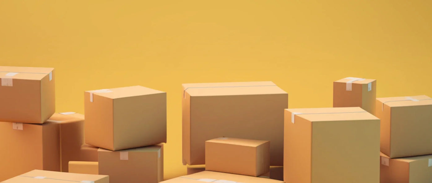 Many cardboard boxes stacked against a yellow background: how much does eBay take from a sale