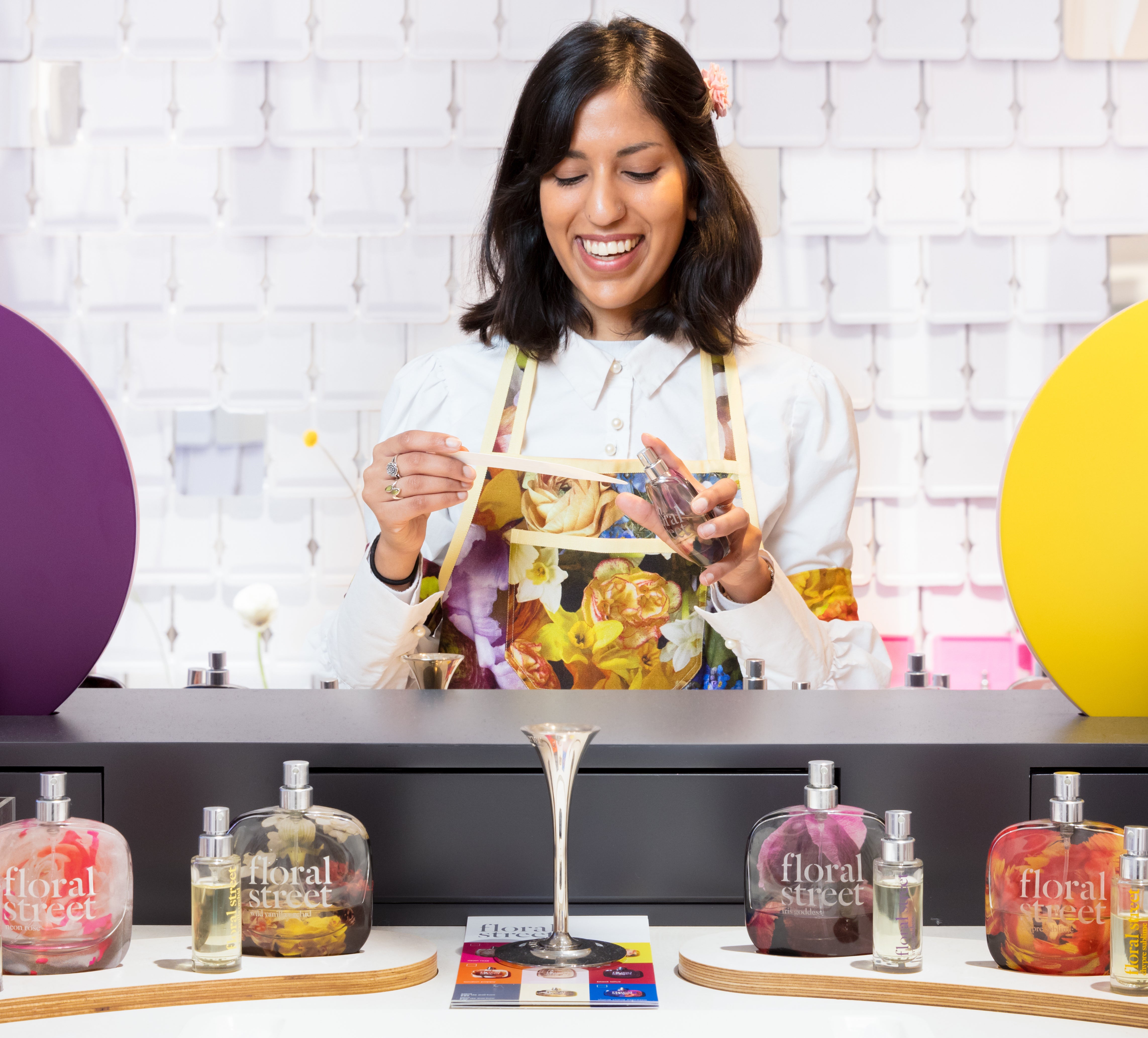  A Floral Street employee holds a fragrance test sample. 