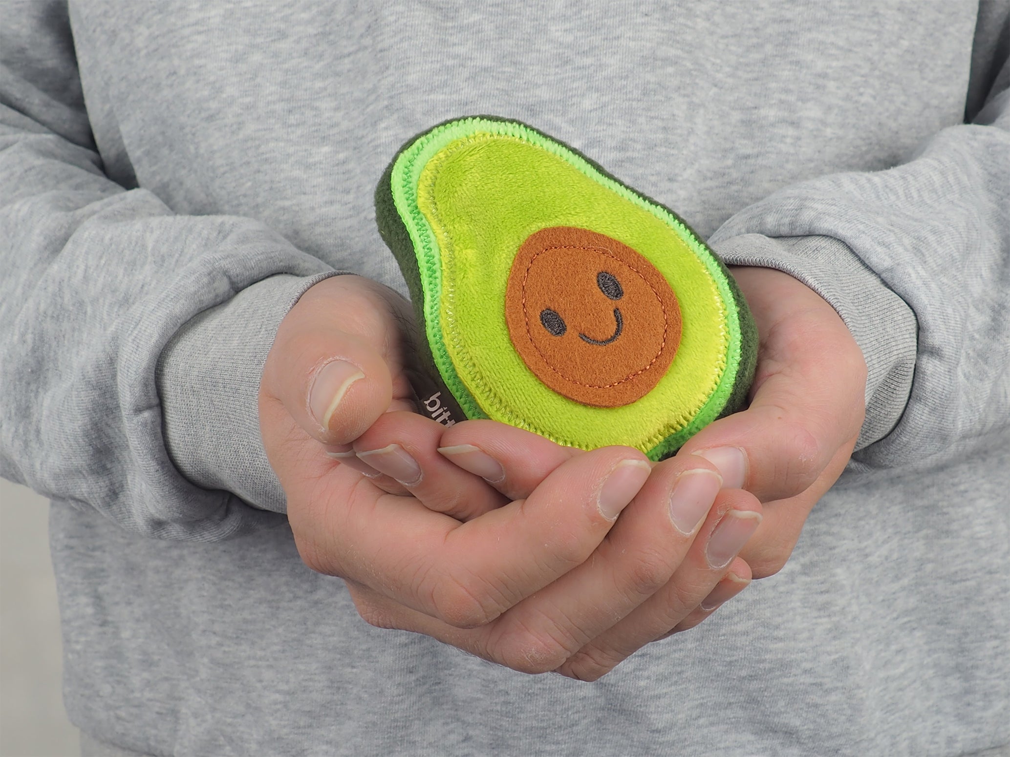 An avocado shaped stuffed toy by Bitten Design. 