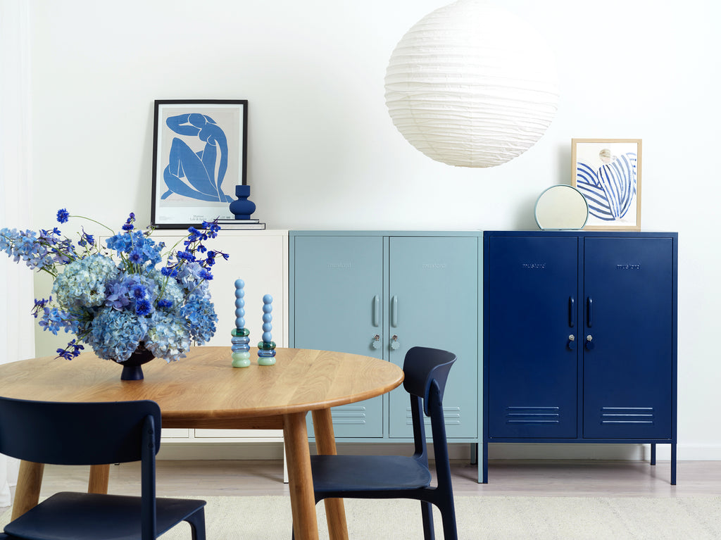 White, light blue, and navy blue Mustard Made lockers in a dining room