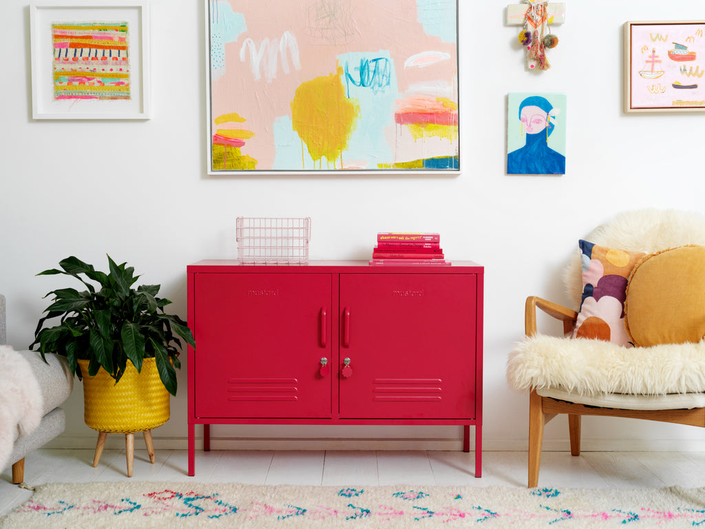 Red Mustard Made locker between an armchair and a plant