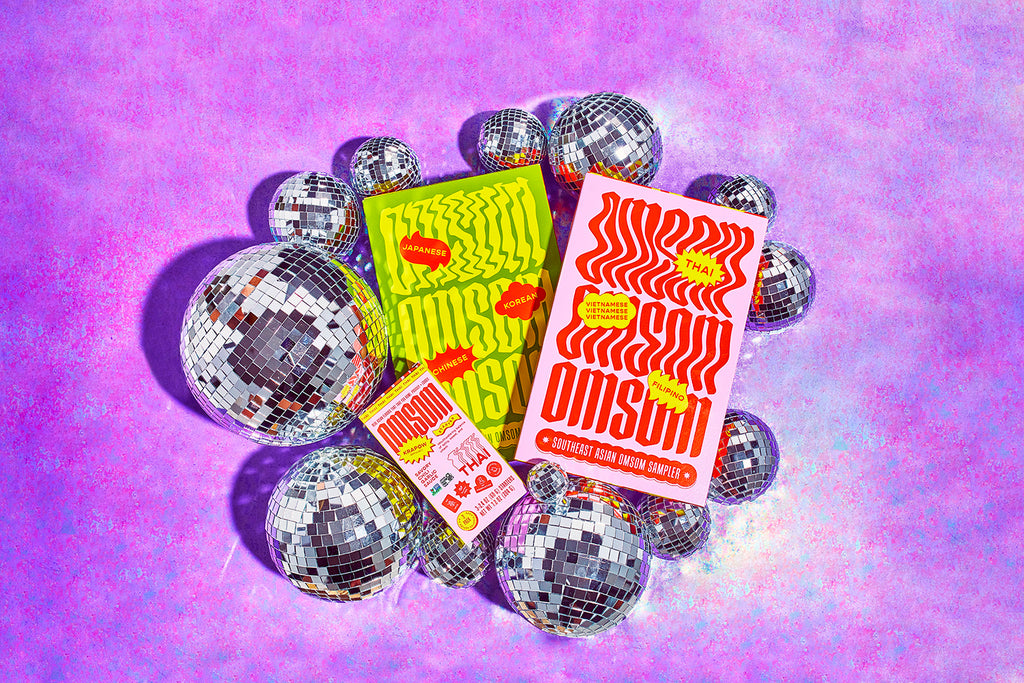 Omsom spice packets surrounded by disco balls