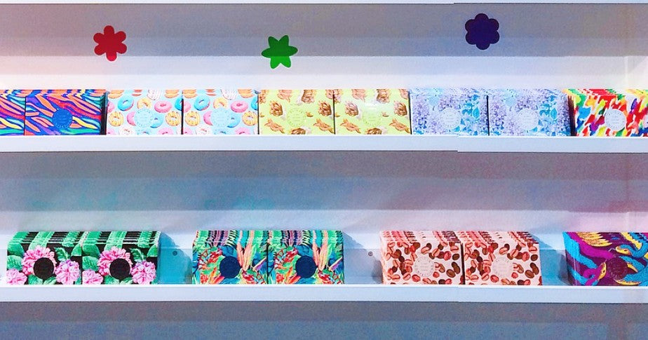 The wall display of Alicja Confections postcard chocolate bars.