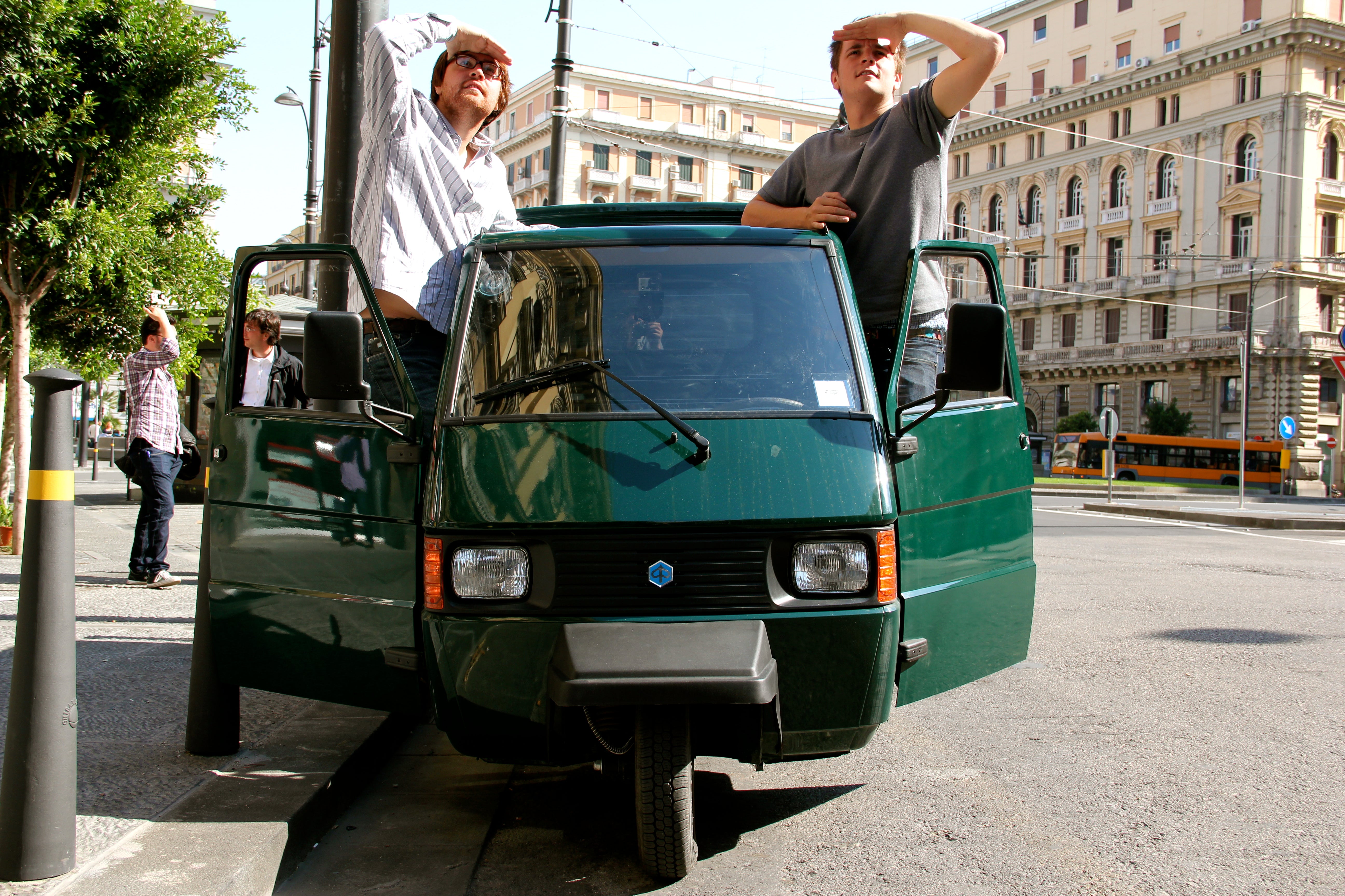 Thom and James Elliot in their Piaggo Ape car in Naples, Italy.