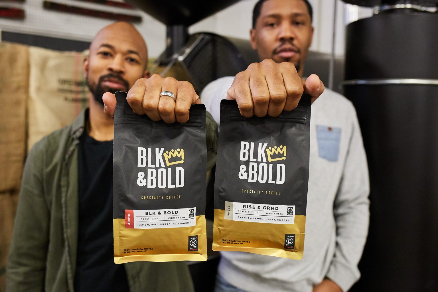 Pernell Cezar (Left) and Rod Johnson holding up bags of their coffee. 