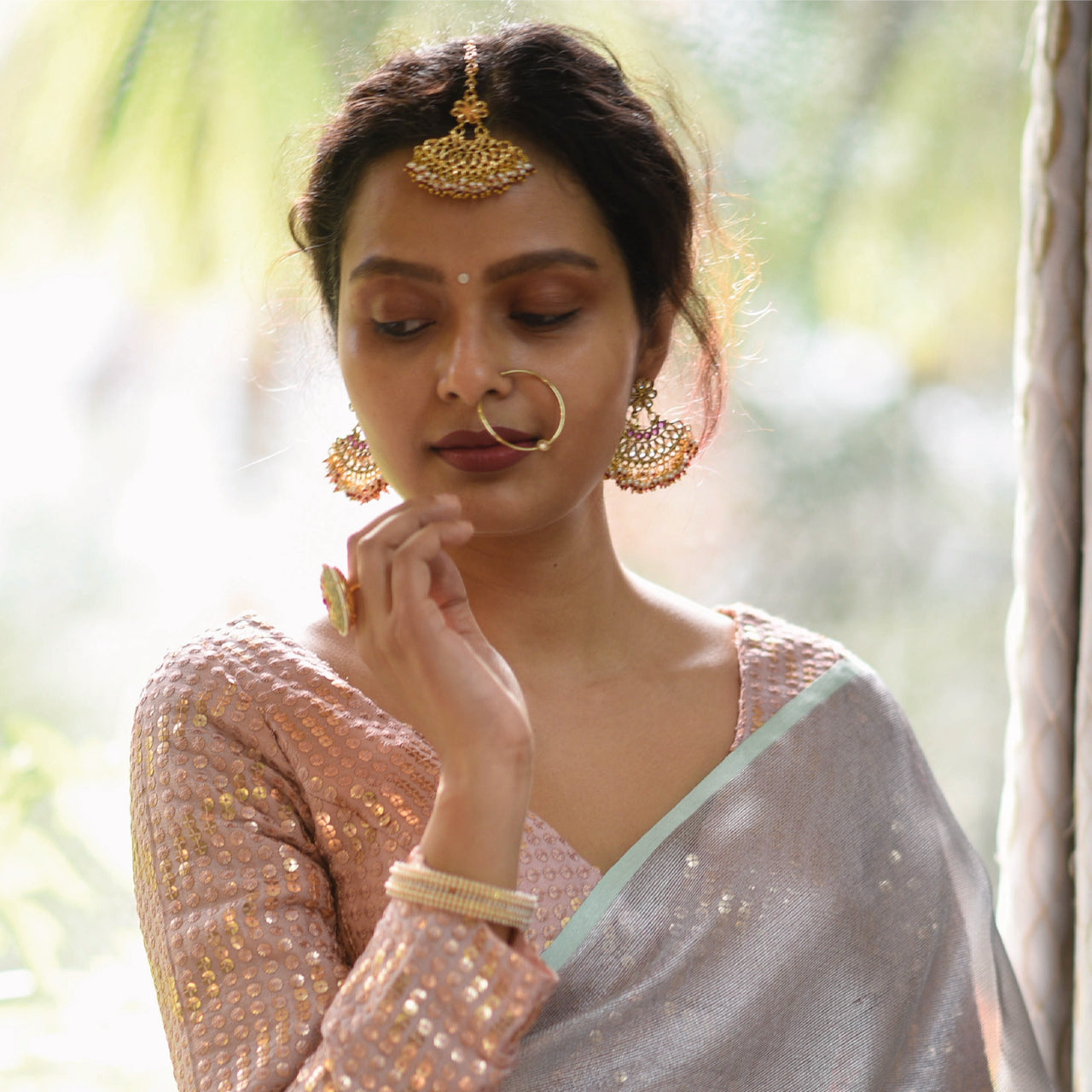 Sujata models a cream saree with a blue overlay. 