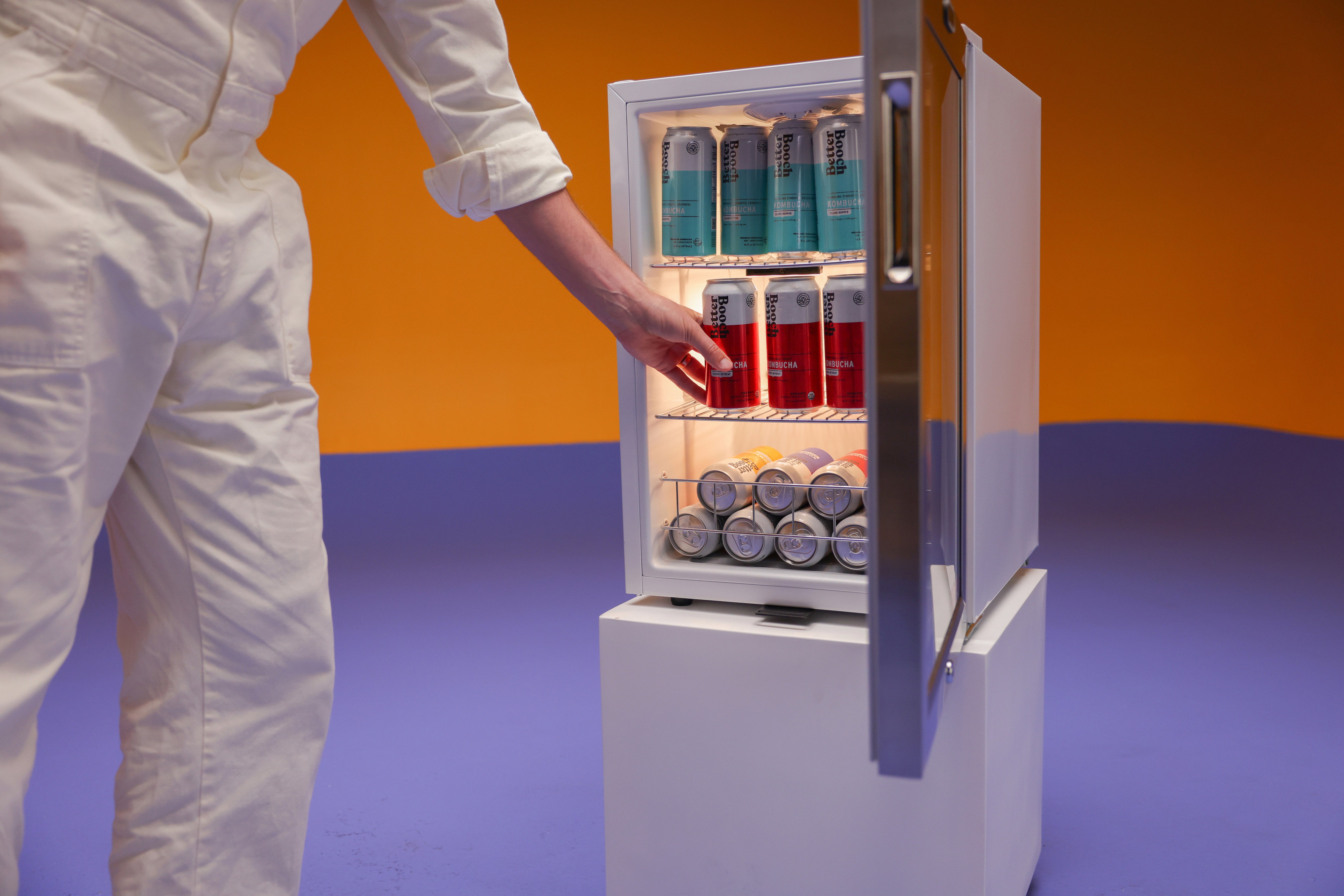 The Better Booch cans sitting and cooling in a mini refrigerator.