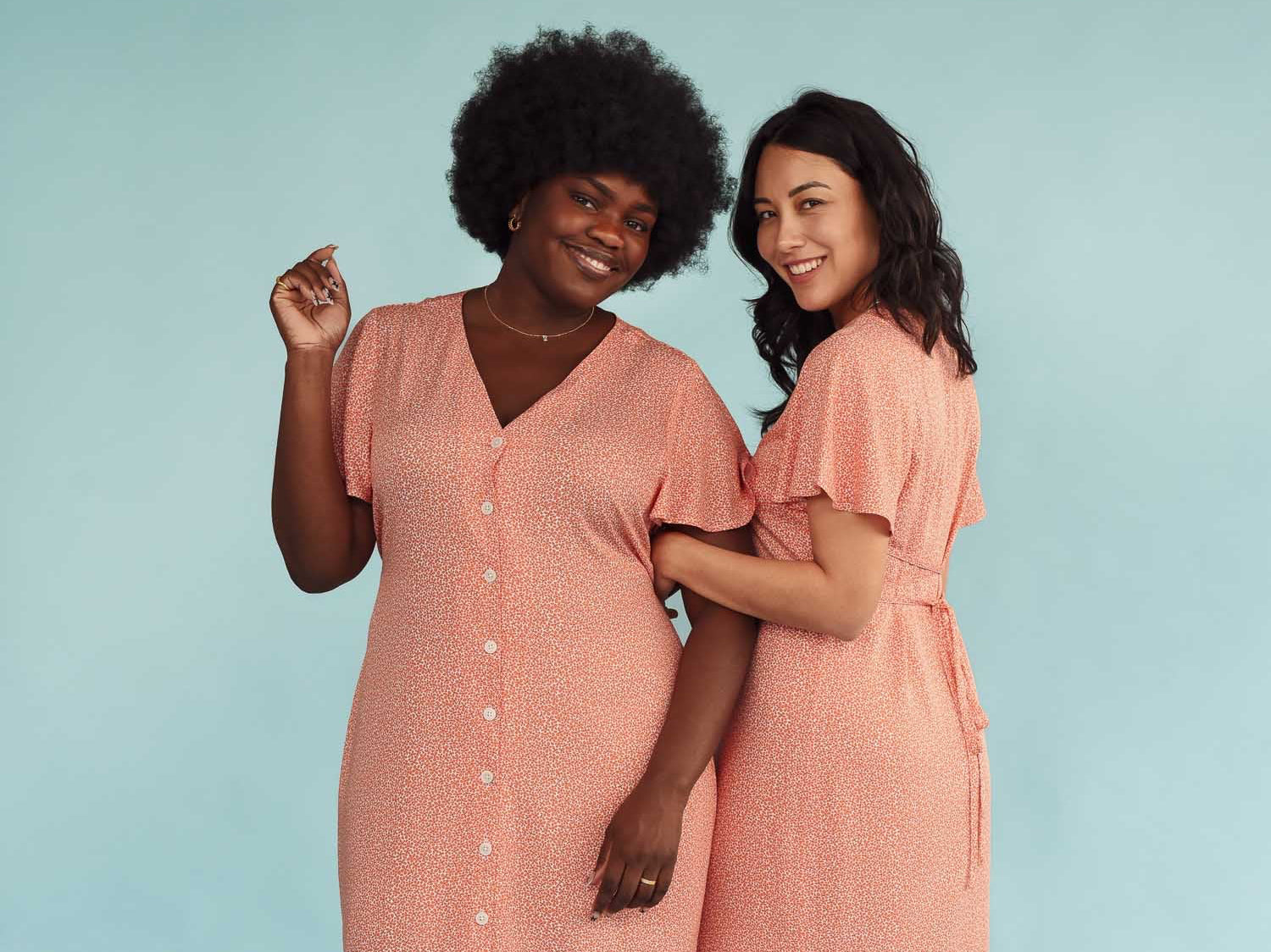 Two models wear peach sundresses