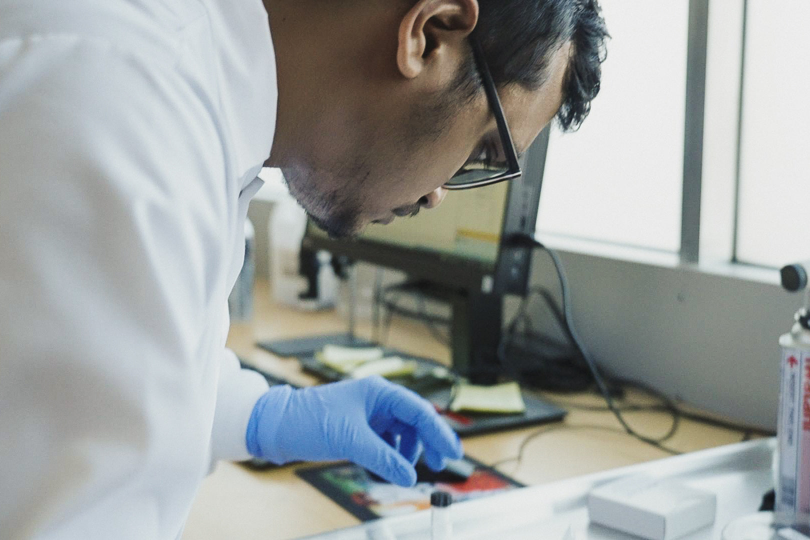 An Heirloom Carbon employee experimenting with their carbon removal solution in their lab