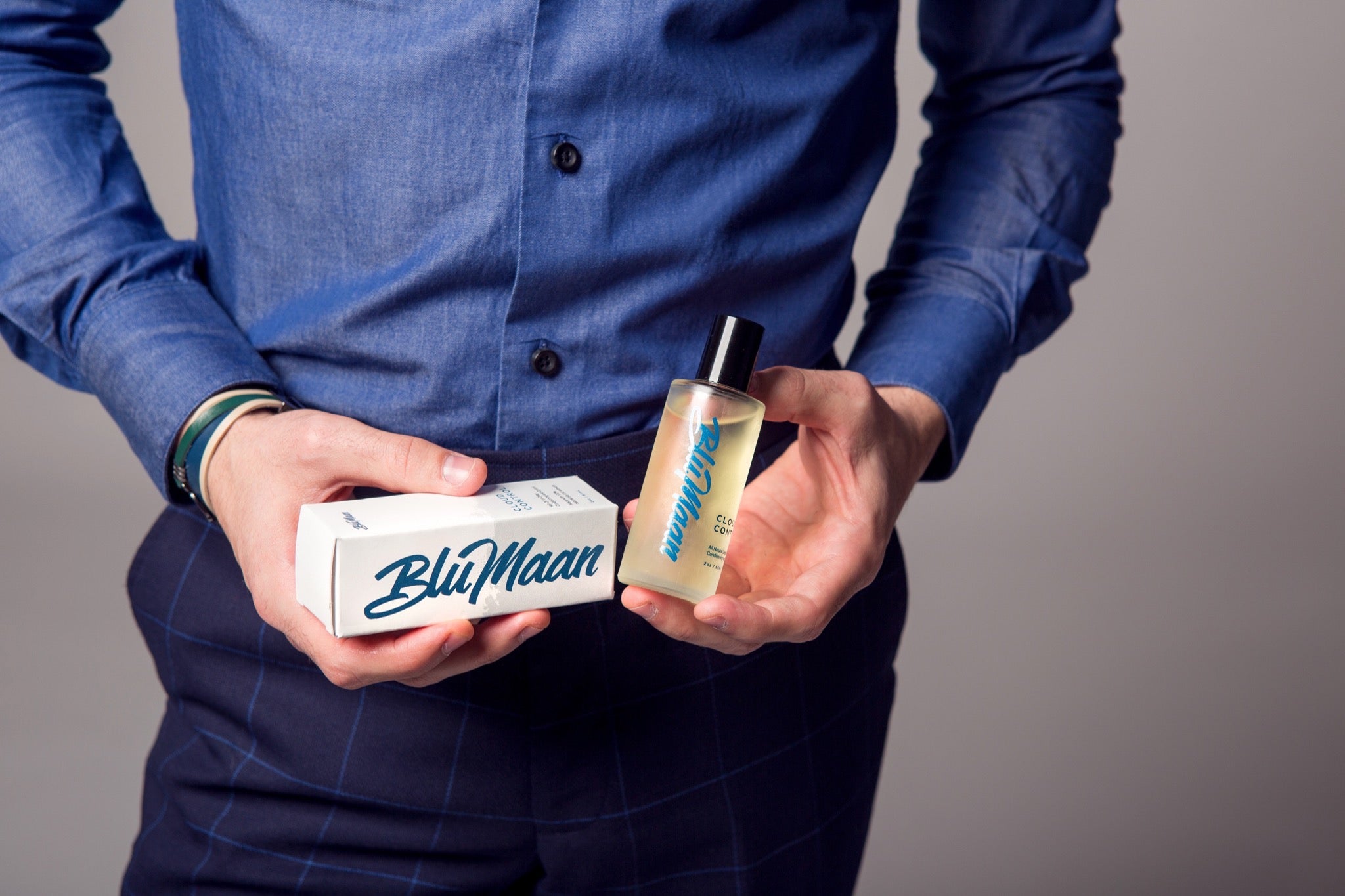 A model holds two products by BluMaan.
