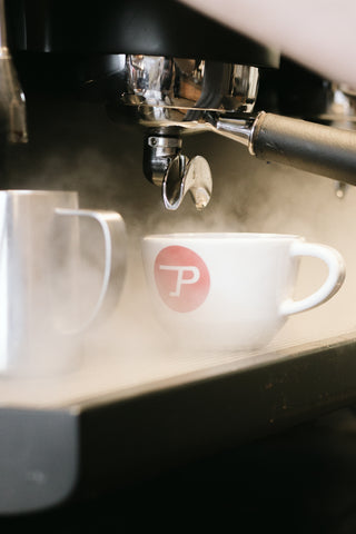 A cup of Propeller Coffee on an espresso machine