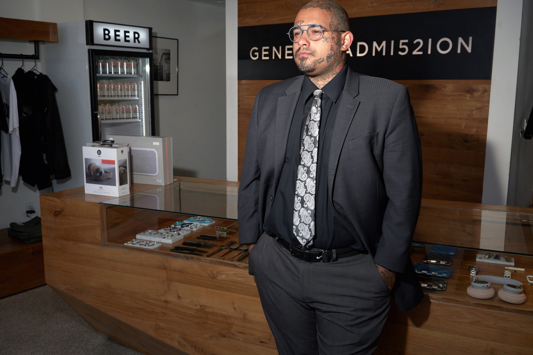 Raul Guzman owner of barber shop Svelte, standing in front of the General Admission cash desk in Venice, California.