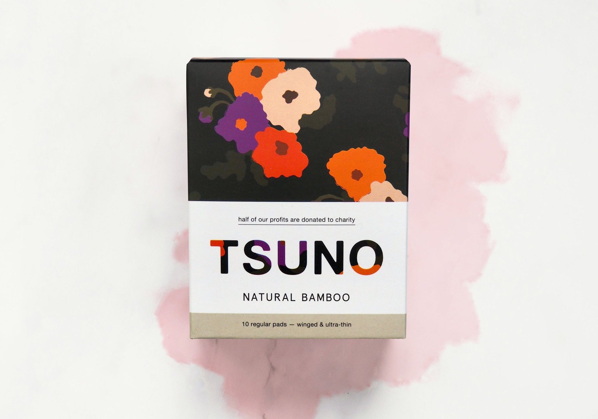 Box of tampons on a pink and white abstract background. The box reads "Tsuno"