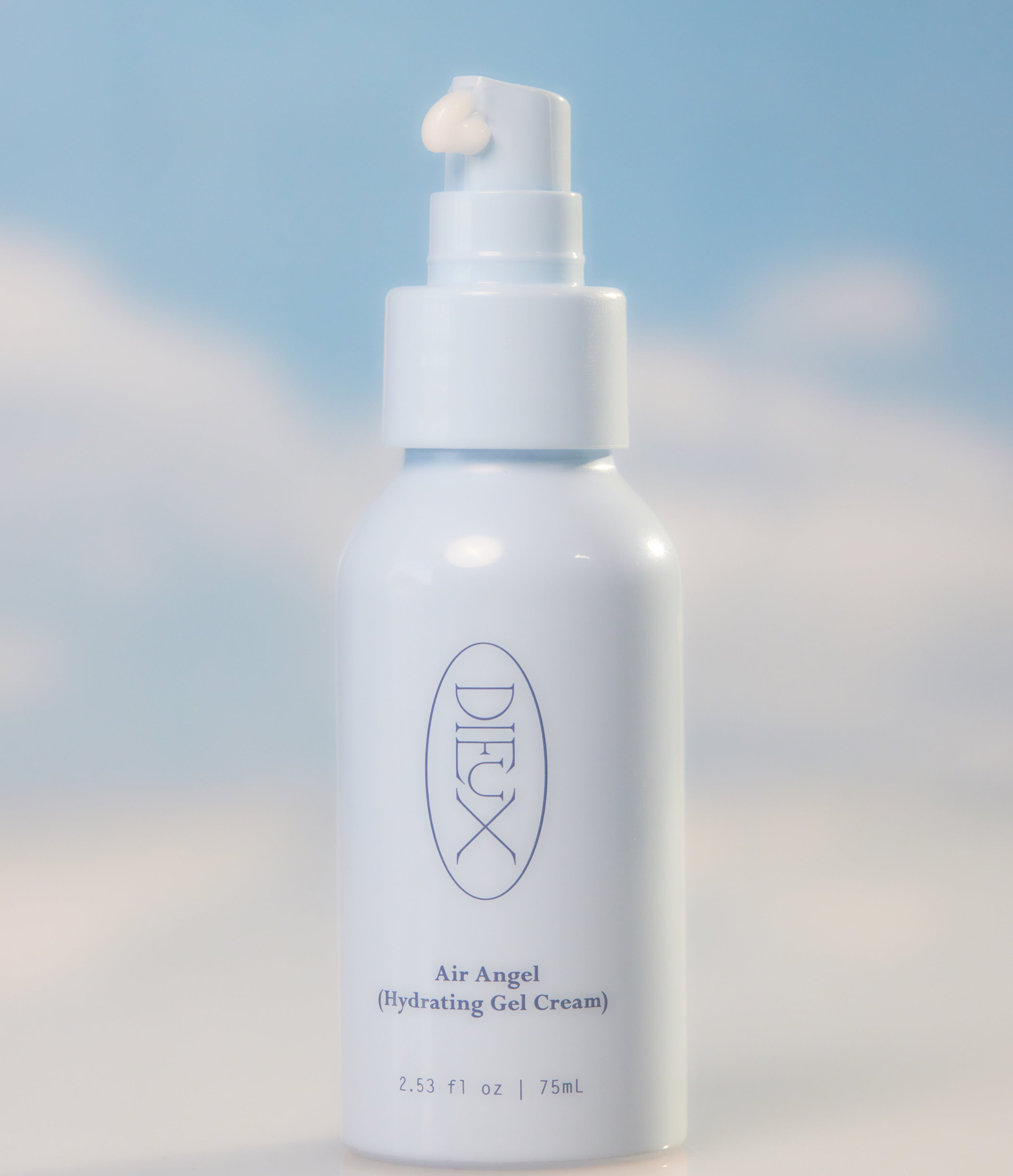 A bottle of Air Angel Gel Cream pictured with clouds behind it and some cream coming out of the top of the bottle.