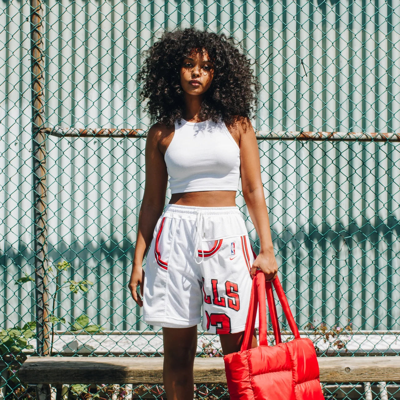 A woman models a pair od shorts made from upcycled jerseys