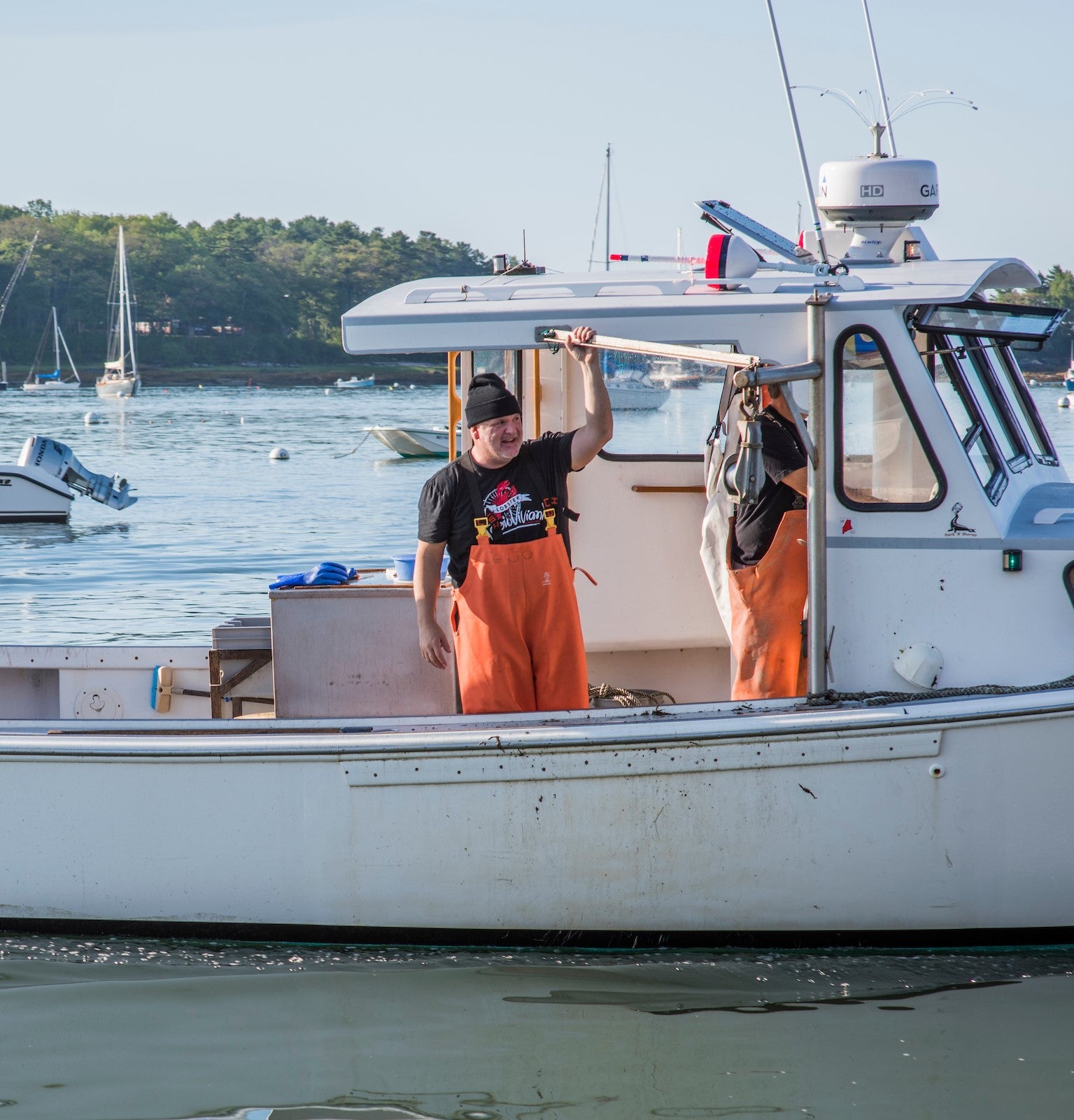  Mark Murrell of Get Maine Lobster on a fishing boat looking out towards the coast of Maine. 