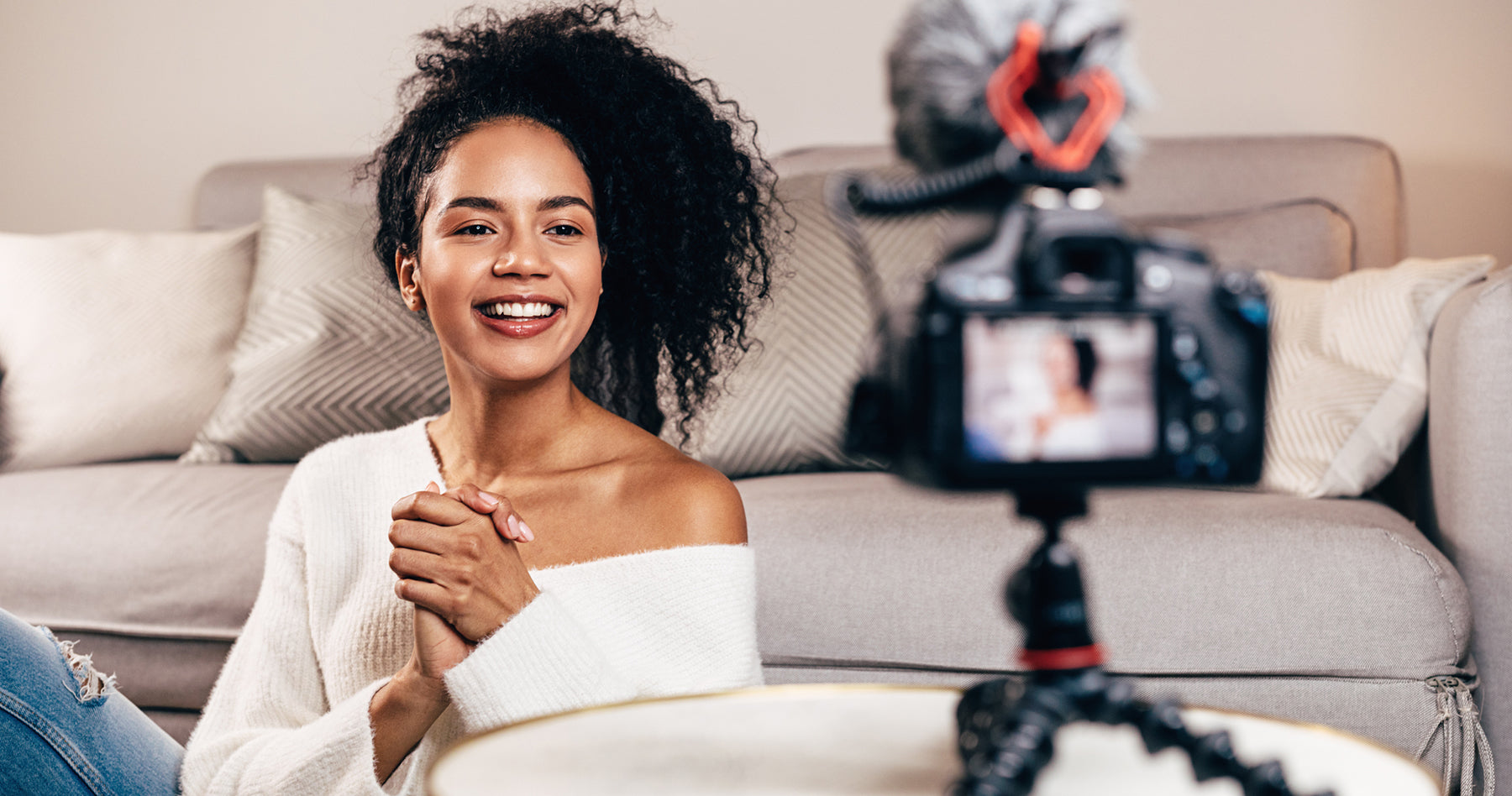 woman sittting in front of camera vlogging