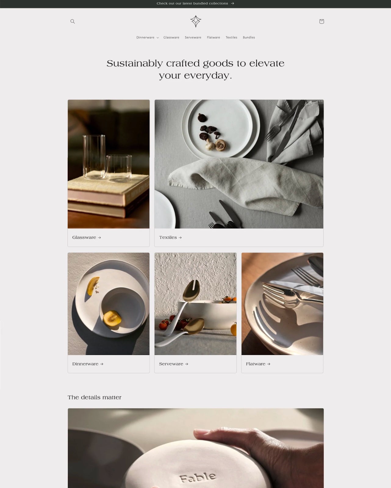 Screenshot of the Craft theme from Shopify, gray color palette, website header design template with flat lay, neutral product photos.