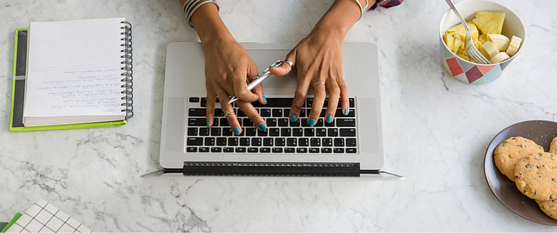 Woman typing on laptop