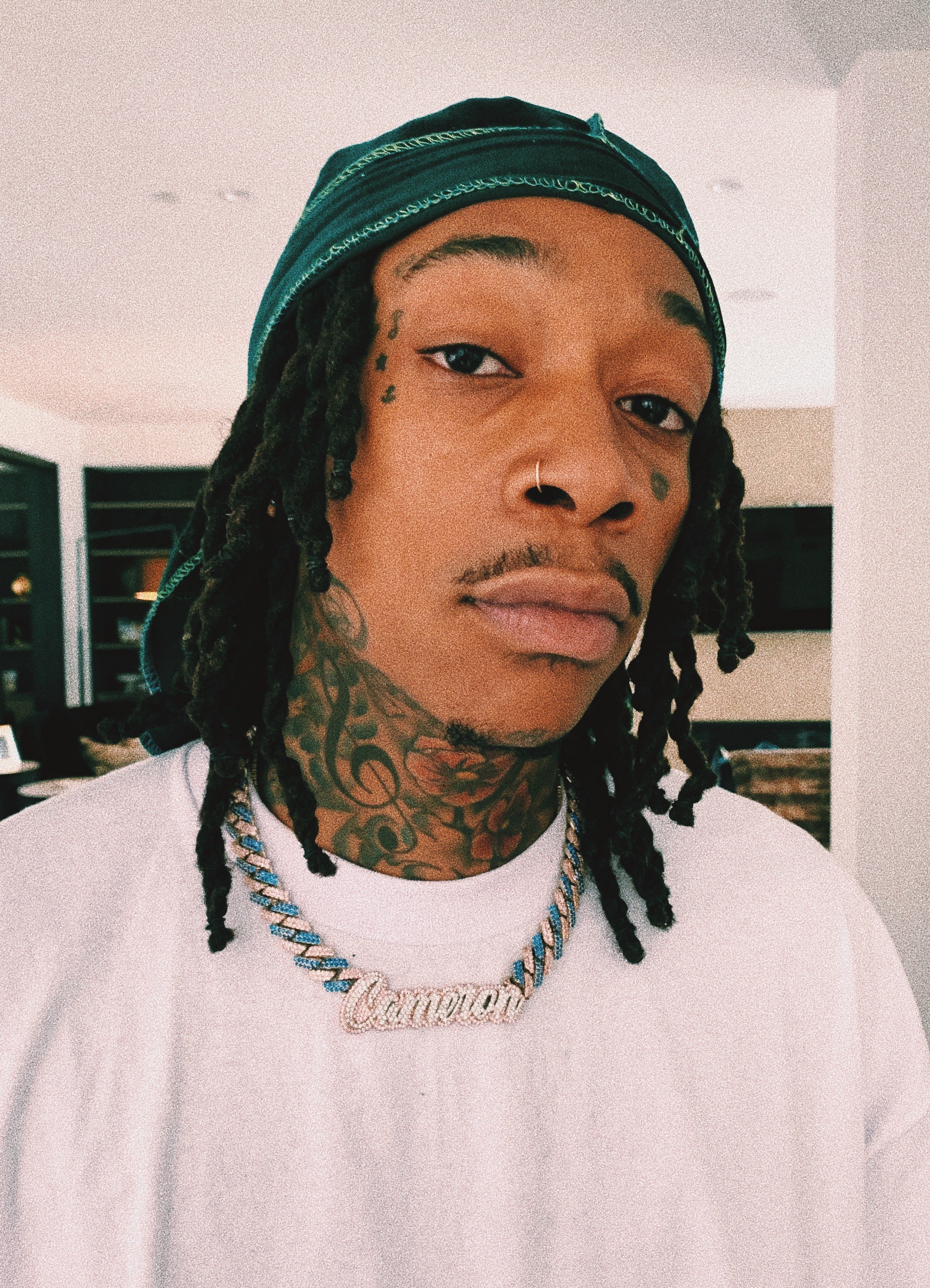 Wiz Khalifa wearing his GLD Shop chain that Christian Johnston designed for him.