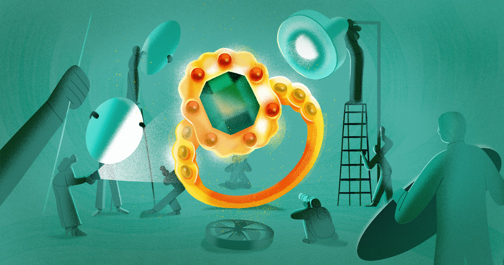 Illustration of a photo shoot for jewelry where the ring is center focus and a team is prepping lights and equipment in the background
