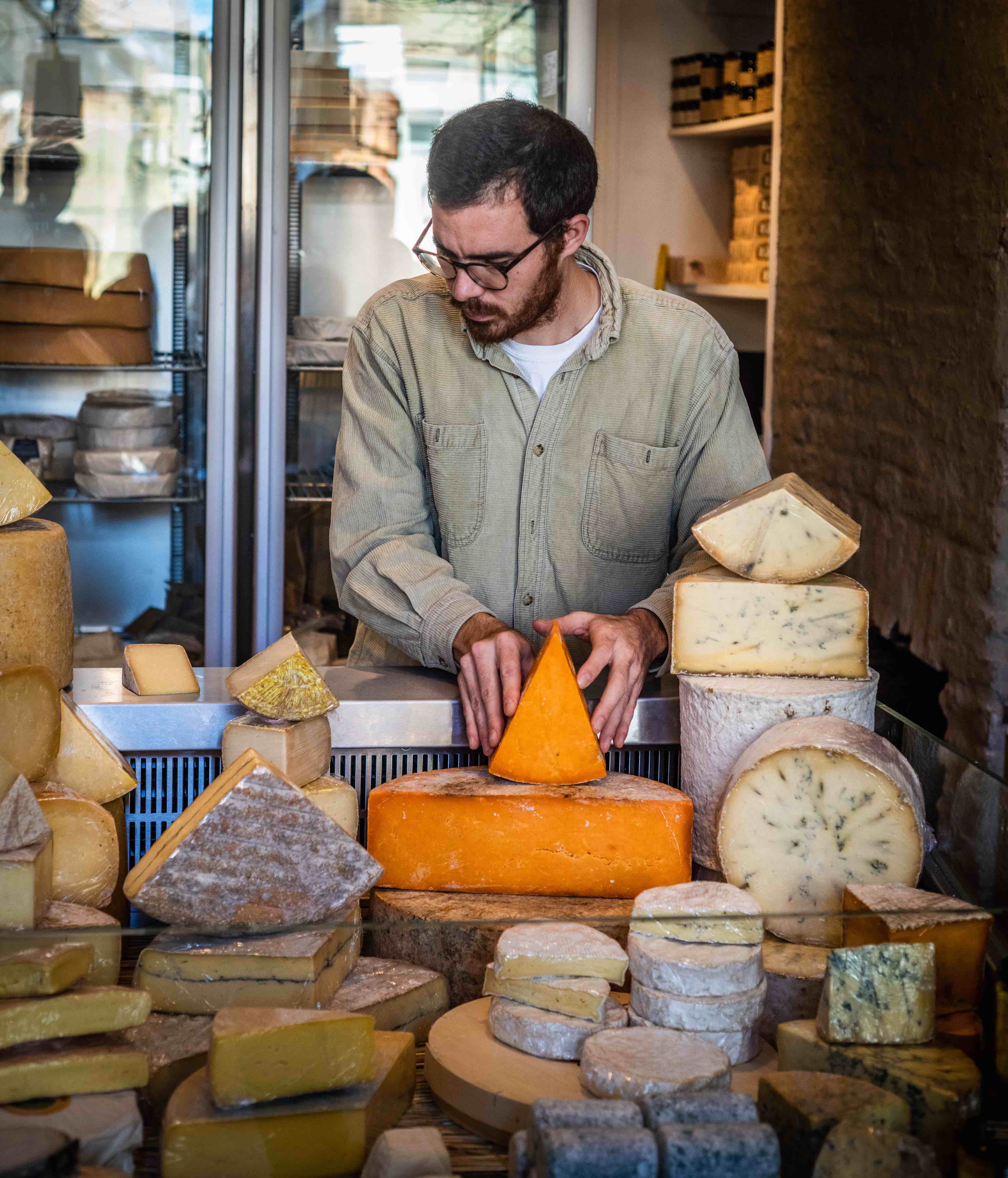 Mathew Carver, in his retail location, Funk, which showcases a wide variety of British cheeses. 