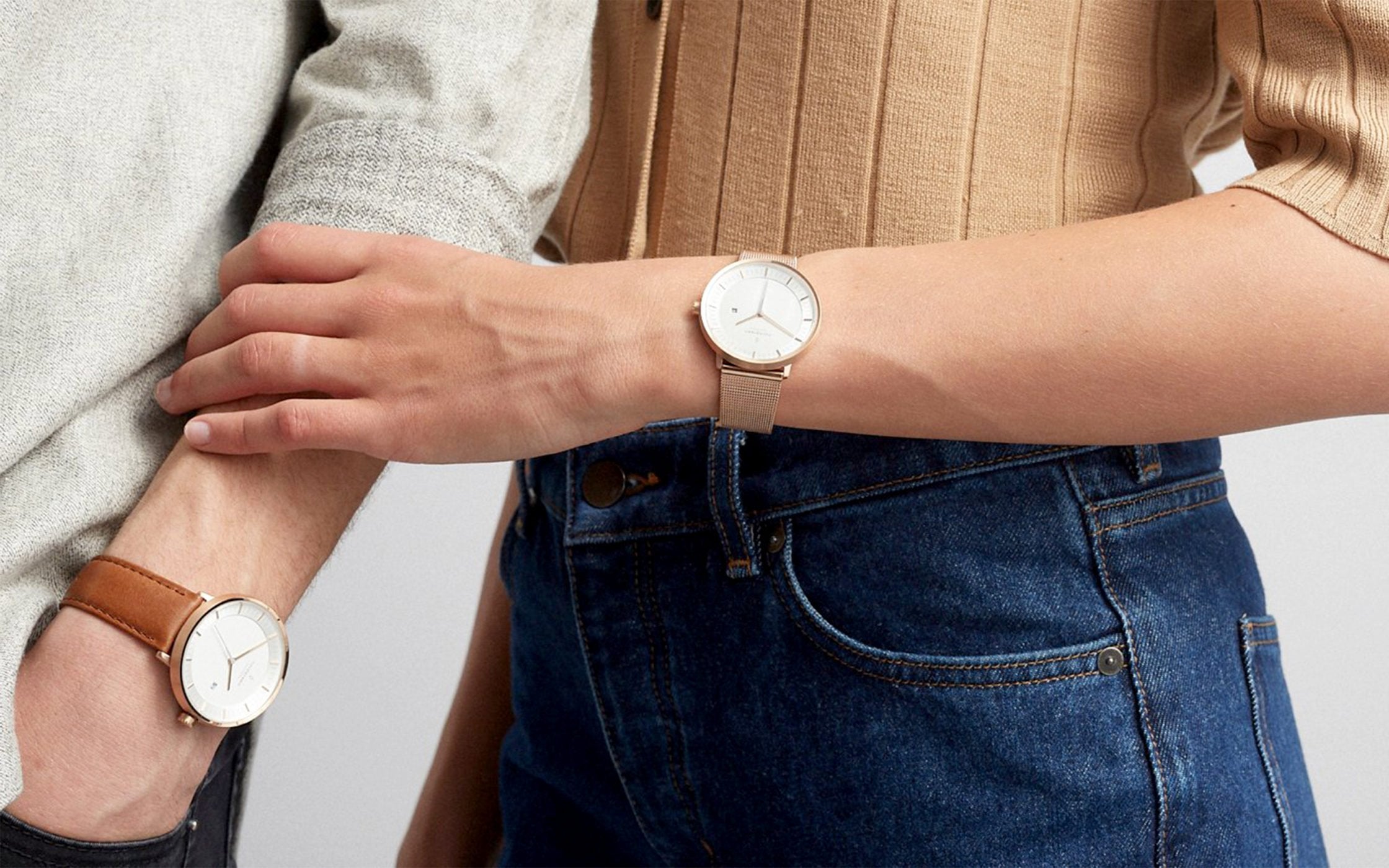 A pair of models wearing watches from Nordgreen. 