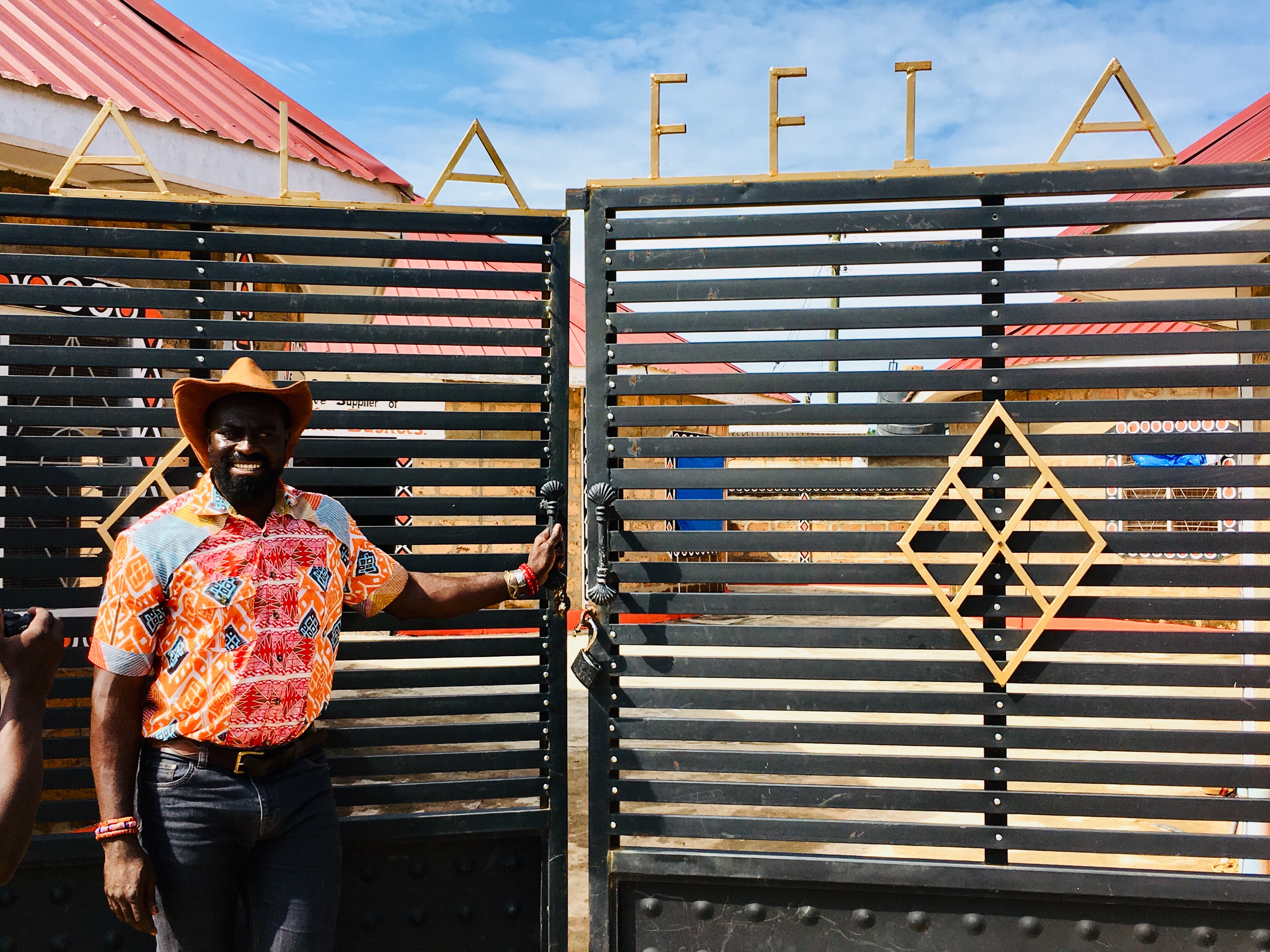 Olowo-n’djo Tchala in front of the Alaffia’s cooperative in Togo. 