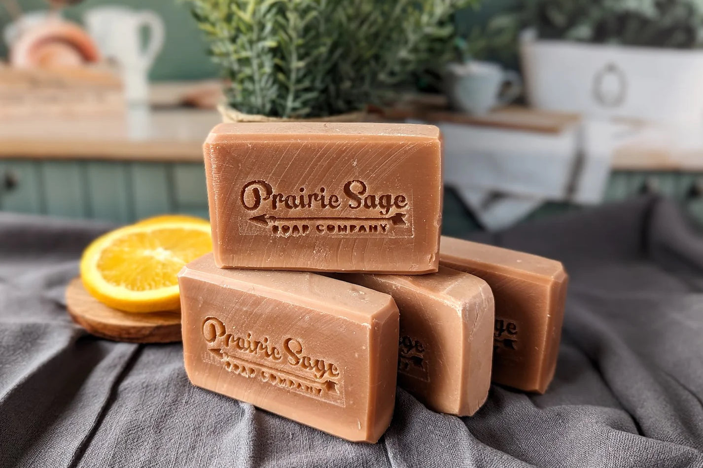 Soap bars stacked on a table with natural ingredients