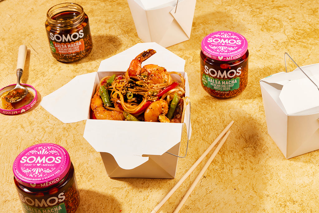 Jars of Somos and Chinese takeout boxes of shrimp noodles