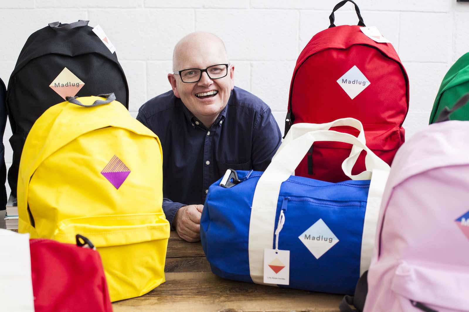 Madlug founder Dave shows off his bags. He donates one to a child in foster care for every one he sells.