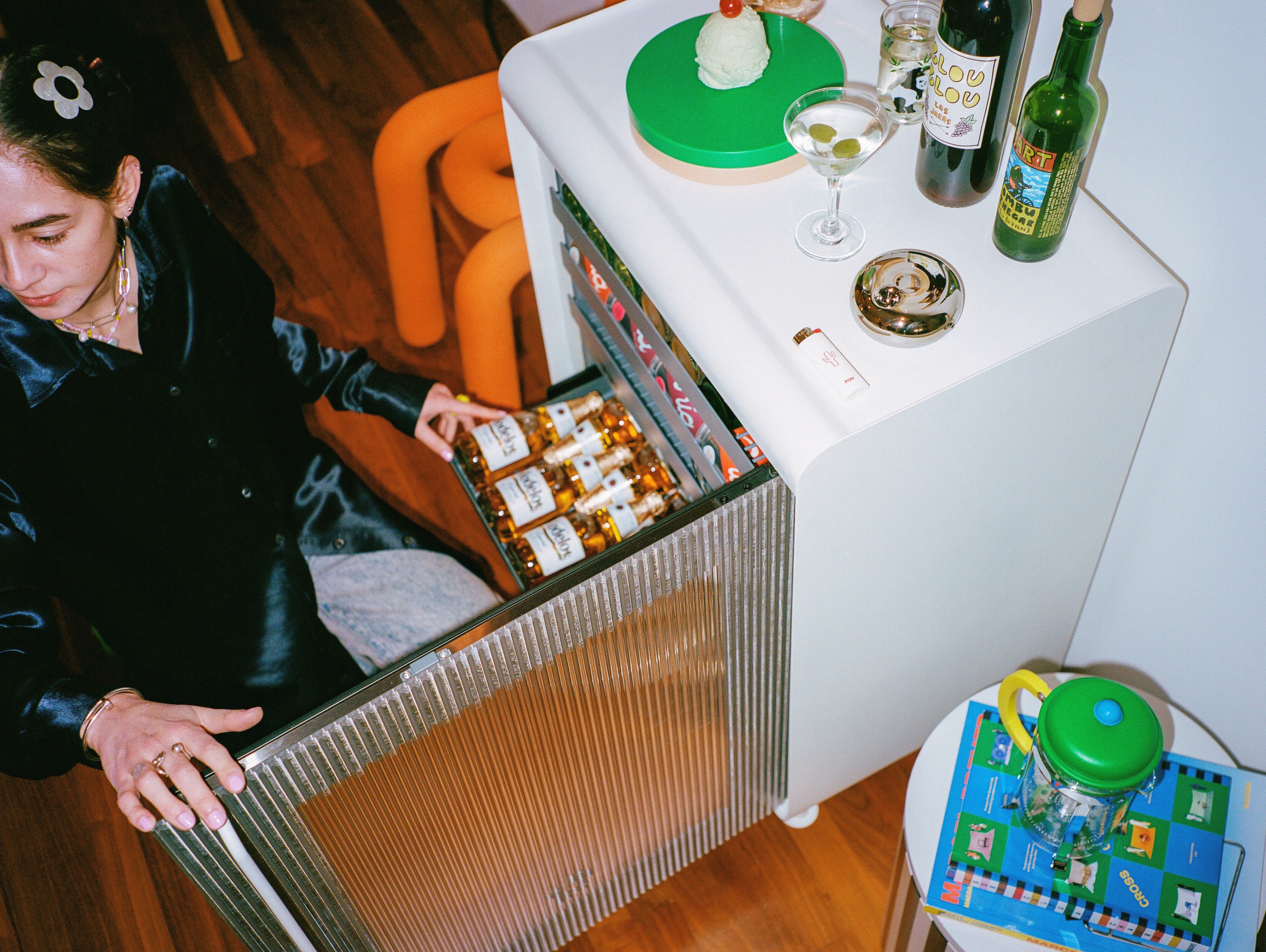 woman opening a stocked Rocco fridge