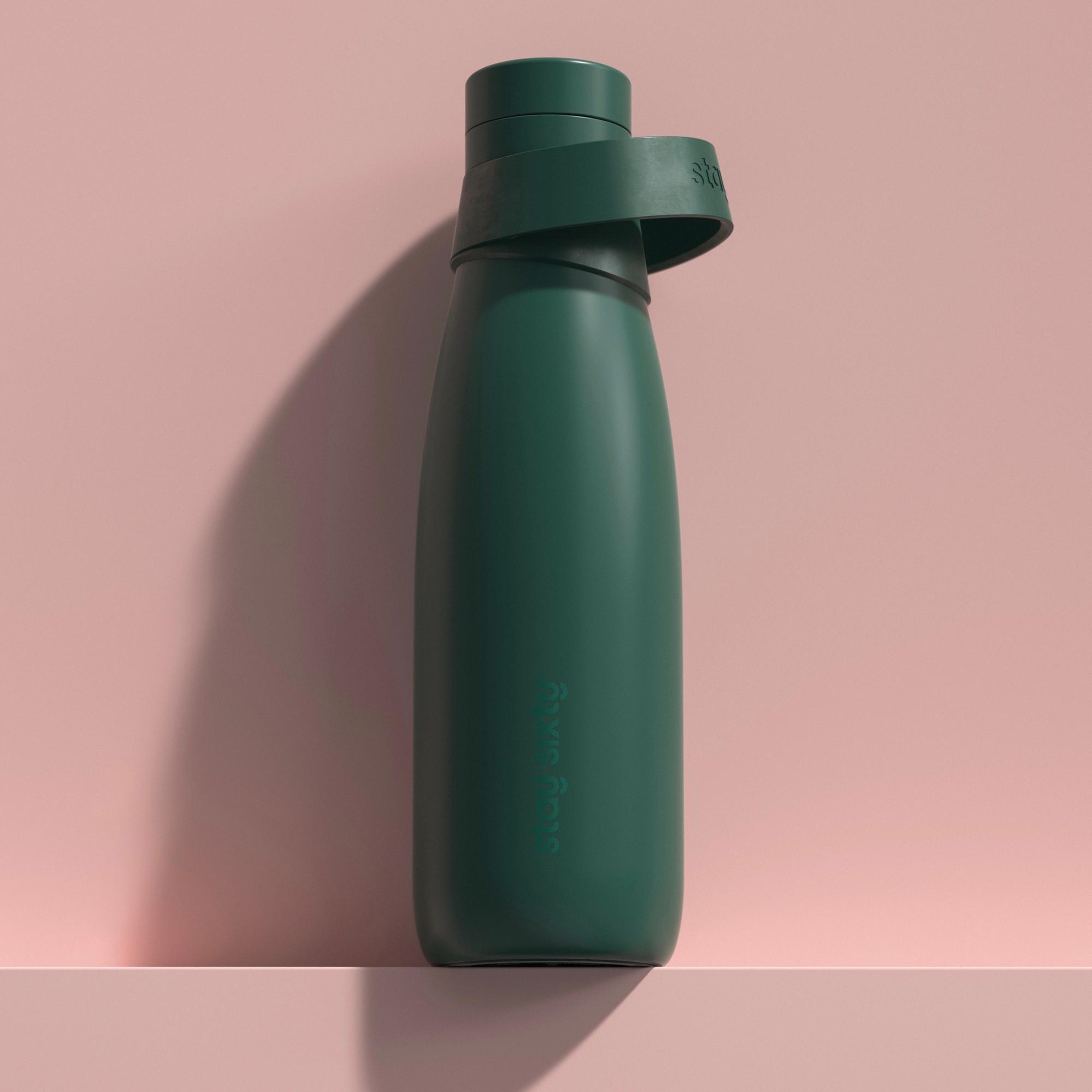 An emerald water bottle by Stay Sixty. 