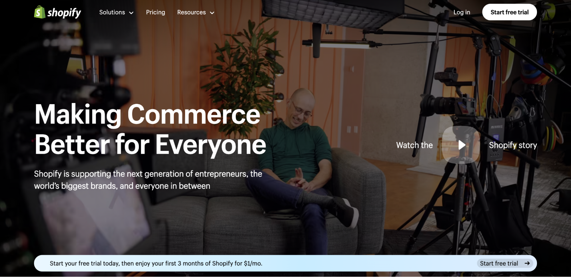 Shopify logo and navigation bar above a video of Shopify founder Tobi Lütke sitting on a gray couch.