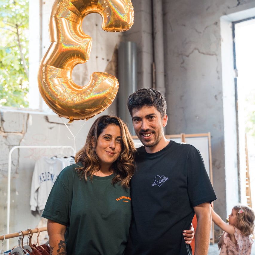 Ali Cavaillé in a green Tajinebanane T-shirt along with her brother Marvin in their retail store celebrating their third business anniversary. 