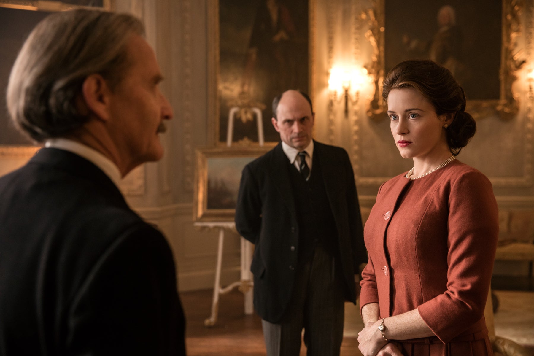 Queen Elizabeth stares at Prime Minister Macmillan (Anton Lesser) in pure disappointment