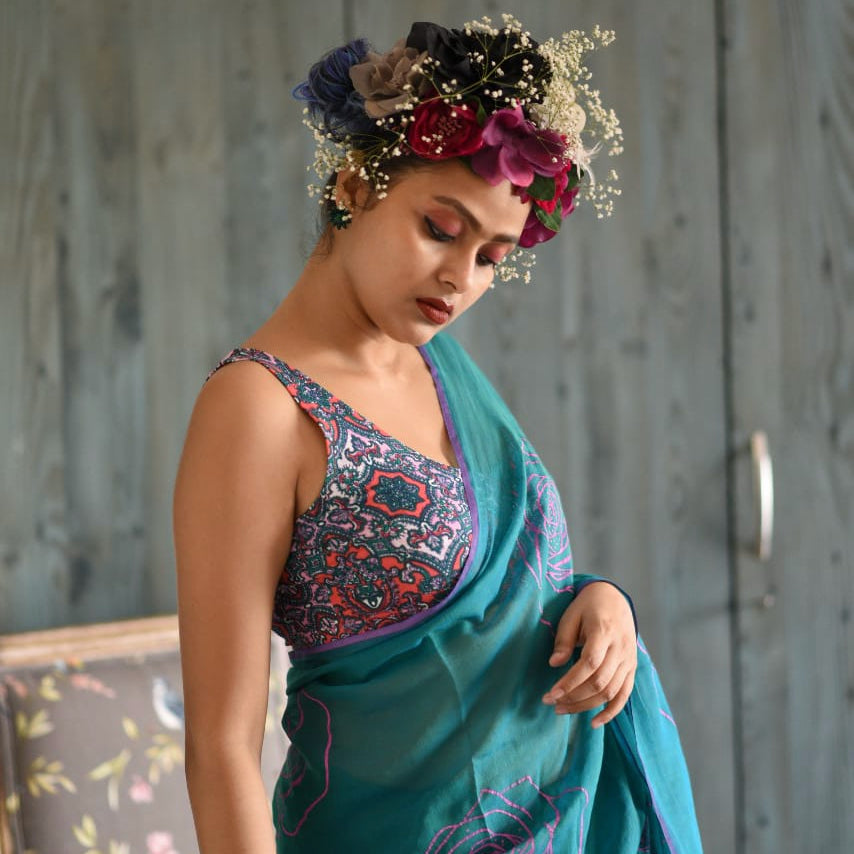 Sujata models one of Suta’s sarees with floral prints. 