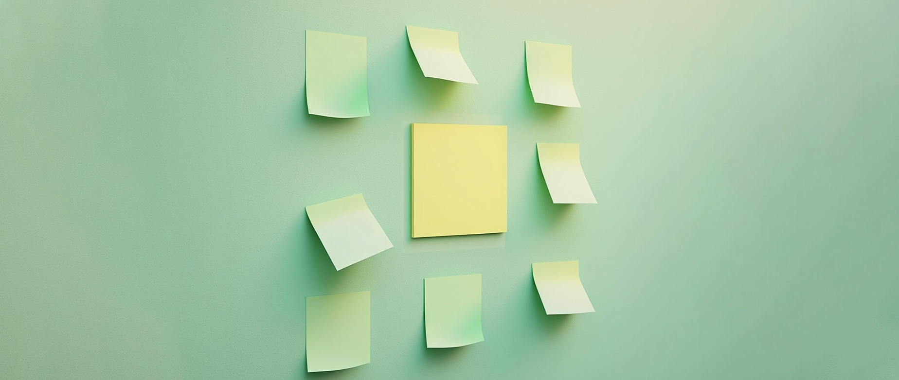 sticky notes on a wall in a kanban board formation