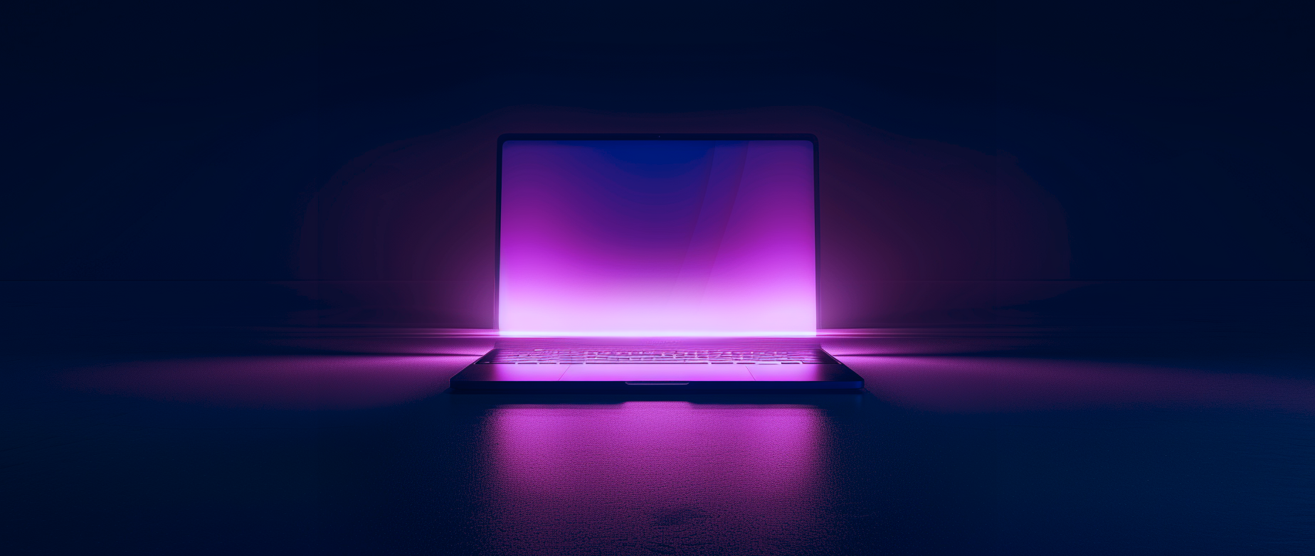 An open laptop with a purple screen on a dark background.