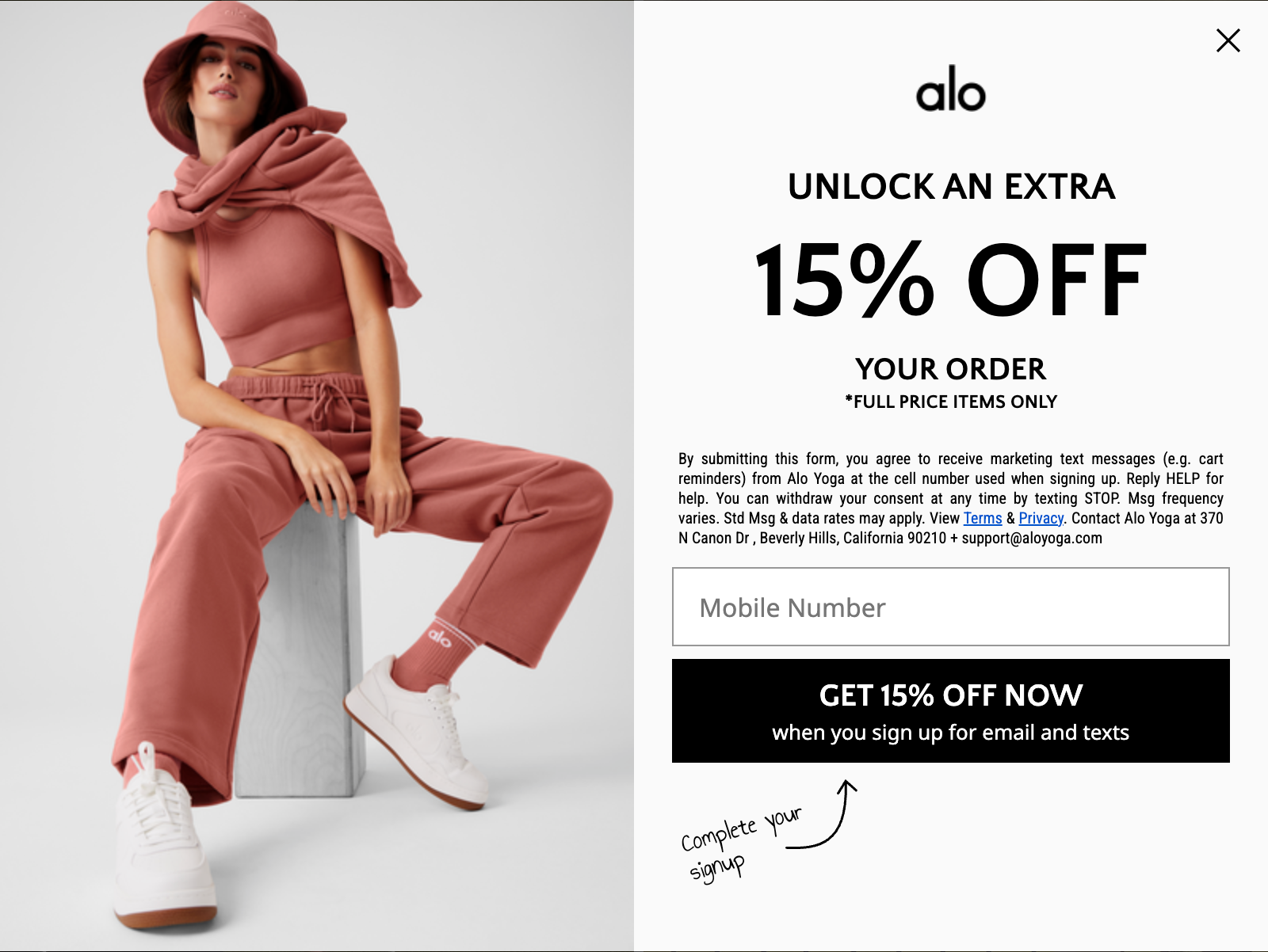 A pop-up advertises a 15% discount in exchange for a submitted mobile number.
