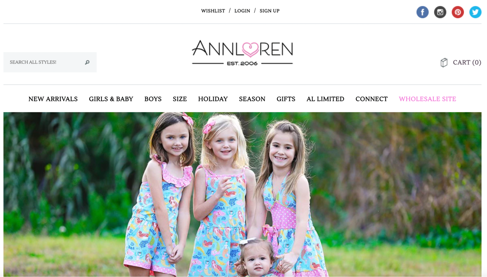 AnnLoren homepage with children modeling matching sets of clothes in a summer garden.