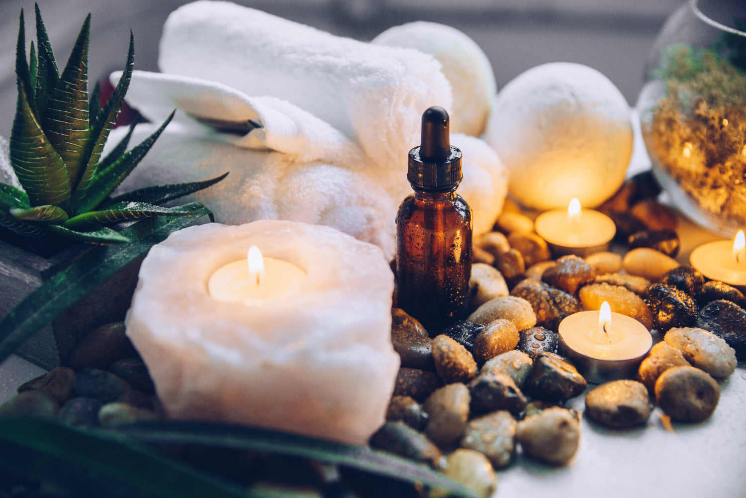 A tranquil array of bath products, oils, rocks, and candles