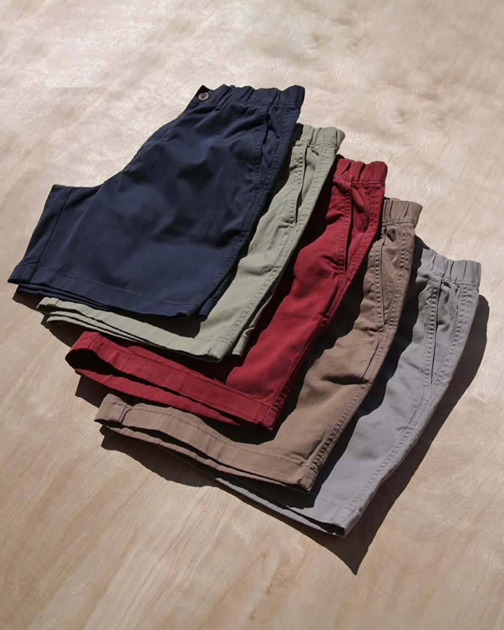 Bearbottom’s Stretch Shorts in navy, green, red, khaki, and gray.